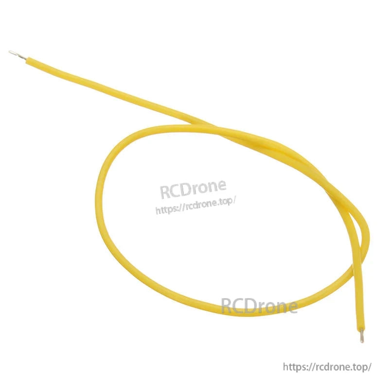Single yellow silicone wire lead coiled with stripped ends, close-up