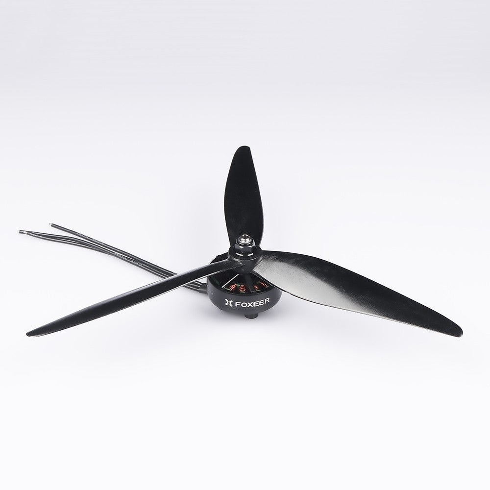 Foxeer Cyclone tri-blade drone propeller mounted on a motor, black glass-fiber style prop with 5mm hub