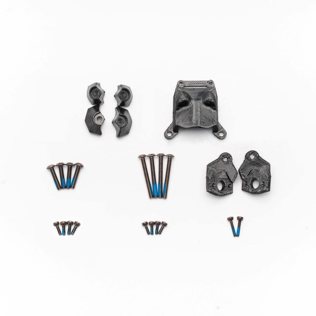 Kit contents layout: printed mounts, side plates, clamp pieces, and multiple blue threadlocked screws