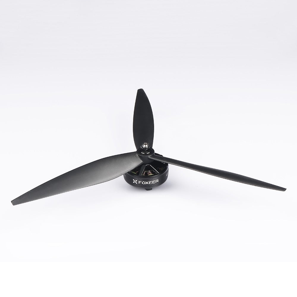 Foxeer Cyclone three-blade drone propeller mounted on a motor, black glass-fiber prop design