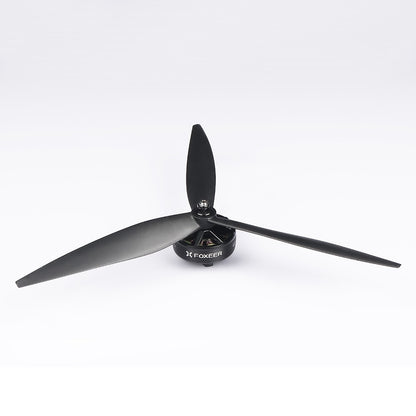 Foxeer Cyclone three-blade drone propeller mounted on a motor, black glass-fiber prop design