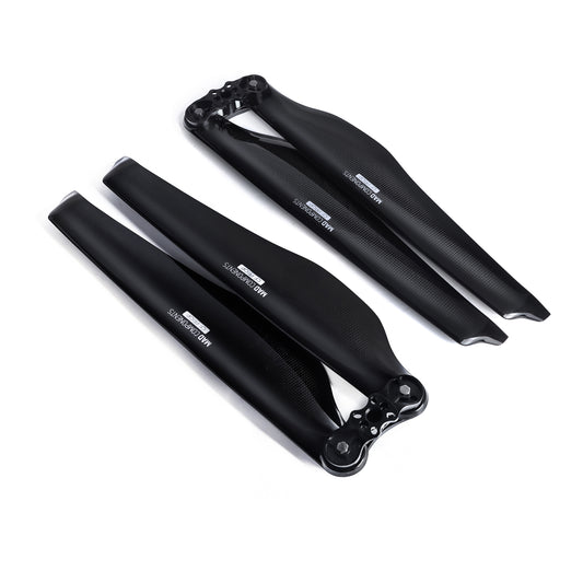 Black glossy carbon fiber folding propeller set with two blades and center hub for multirotor drones