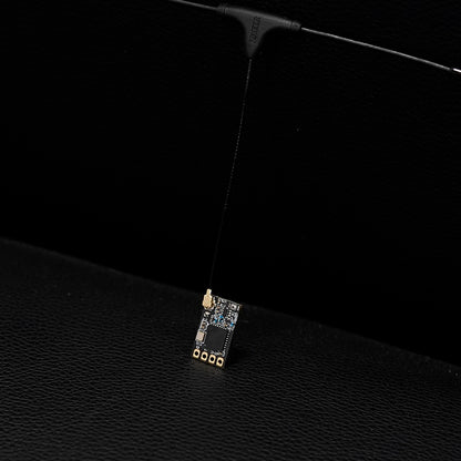 Foxeer ELRS 915/868MHz receiver module with u.FL antenna connector and long whip antenna on a small PCB