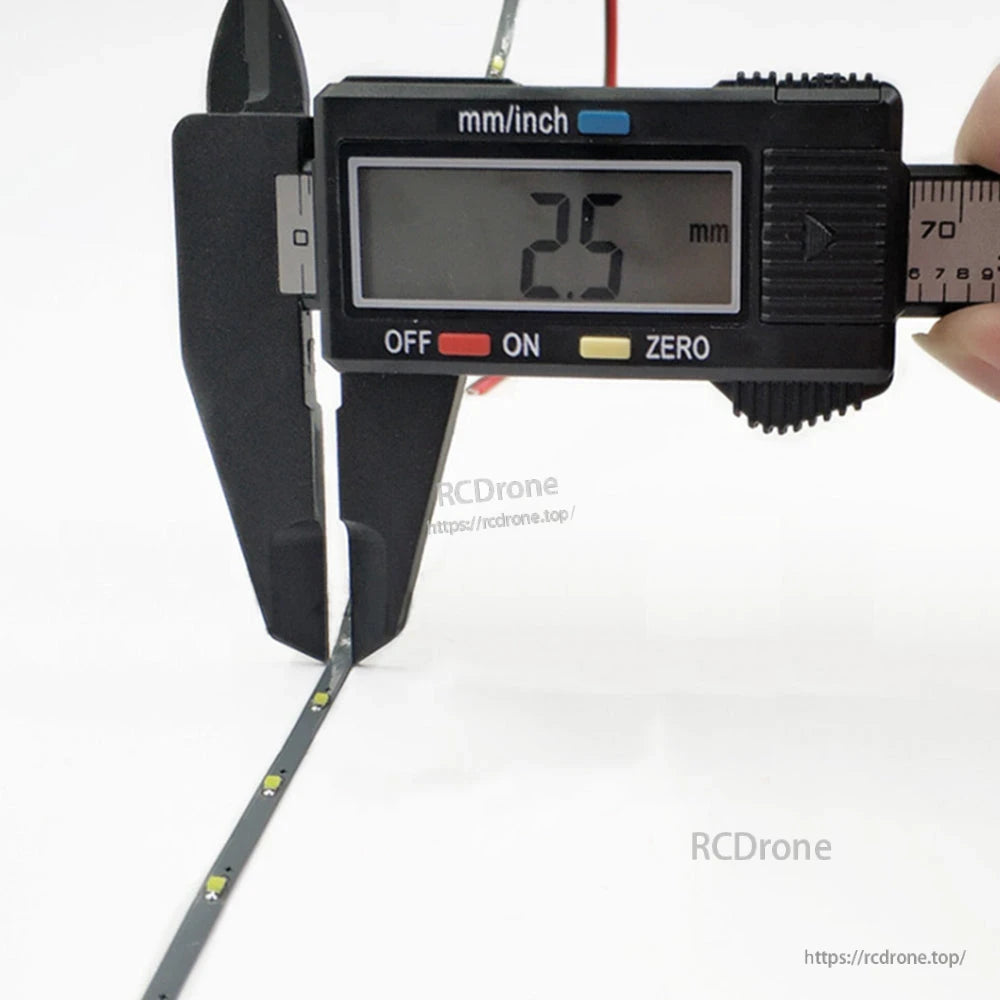 1M 2.5mm DC 5V Dream Color LED Strip Light width measurement, digital caliper reads 2.5 mm
