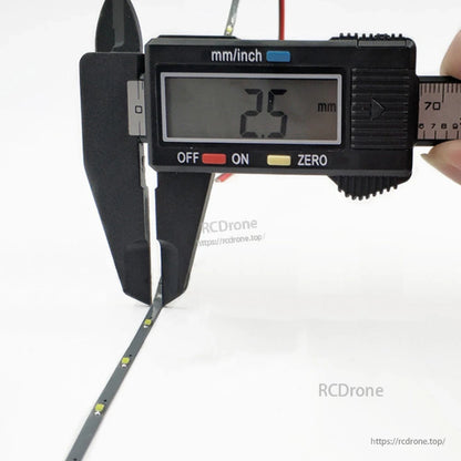 1M 2.5mm DC 5V Dream Color LED Strip Light width measurement, digital caliper reads 2.5 mm