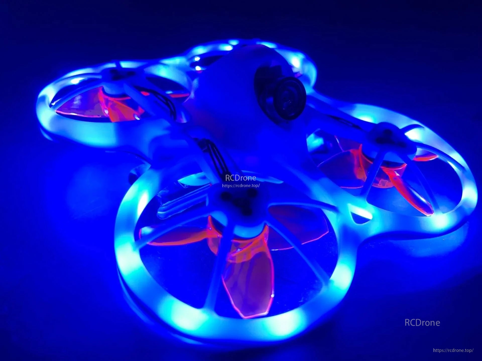 1M 2.5mm DC 5V Dream Color LED strip light installed on a micro RC drone frame, glowing blue