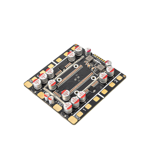 OddityRC Vortex S120 4-in-1 ESC board, angled view showing solder pads and capacitors