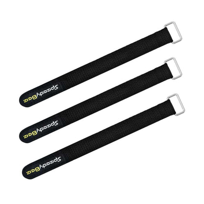 Three black SpeedyBee tie down straps with metal buckles for securing batteries or gear