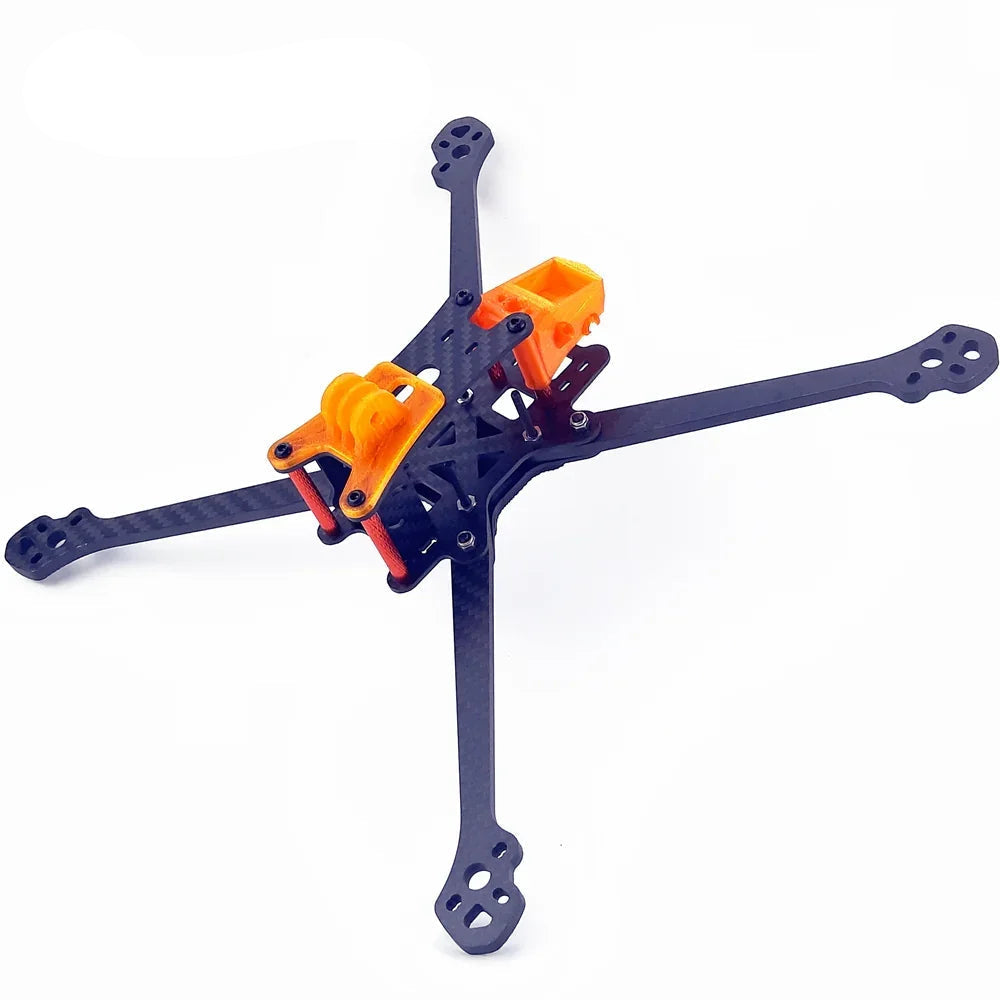Darwin 129 FPV quadcopter frame kit assembled view with carbon arms and orange 3D-printed mounts