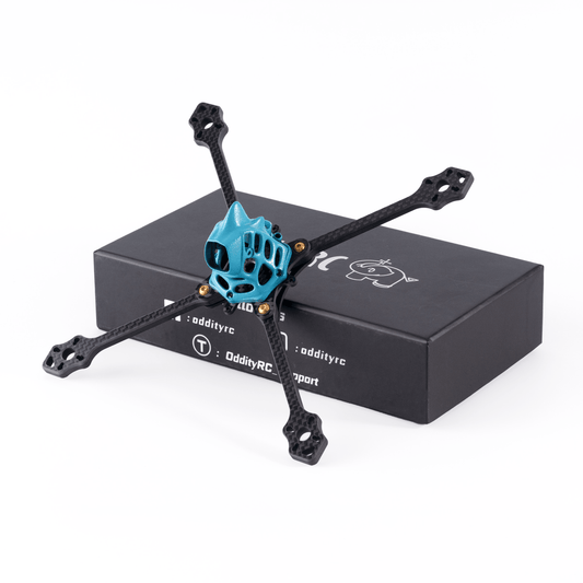 OddityRC 4/5inch toothpick frame kit with blue canopy on carbon fiber arms, shown with retail box