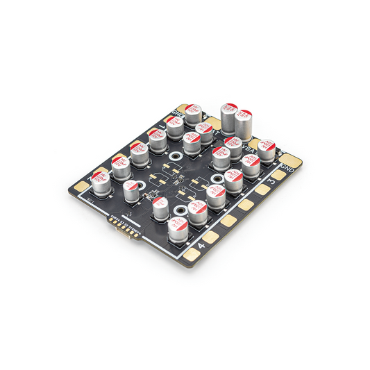 OddityRC Vortex S100 100A 3-8S 4-in-1 ESC angled top view with capacitors and VBAT/GND pads