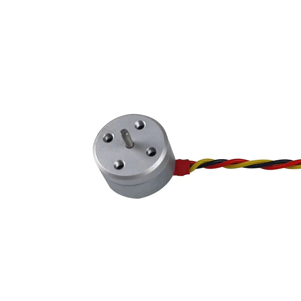 Darwin 1104 4300KV brushless motor close-up, silver can with shaft and red-yellow-black wires