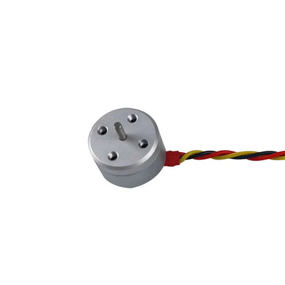 Darwin 1104 4300KV brushless motor close-up, silver can with shaft and red-yellow-black wires