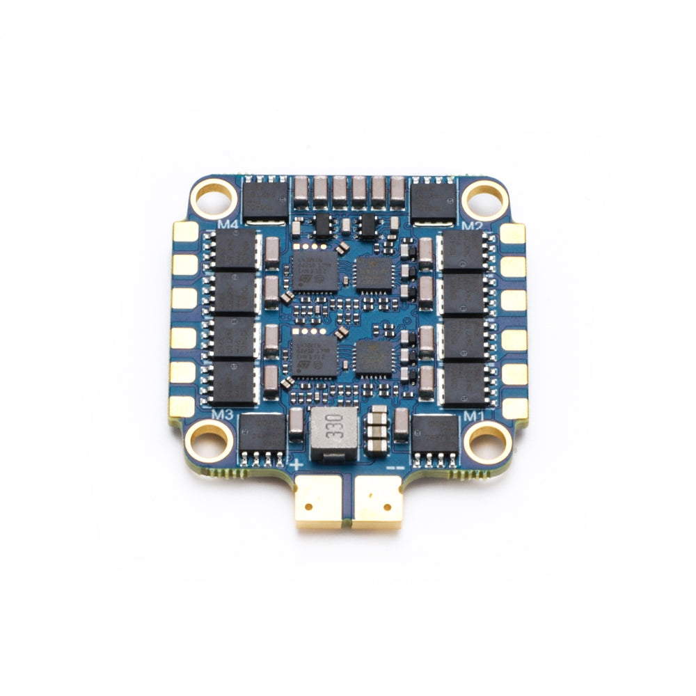 MAD AM32 70A 3-12S 4in1 ESC, MAD AM32 4-in-1 ESC board with labeled M1–M4 motor pads, four corner mounting holes, and compact layout