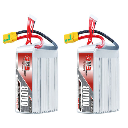 Two GAONENG 8000mAh 6S LiPo batteries standing upright, showing front label and attached XT90S leads