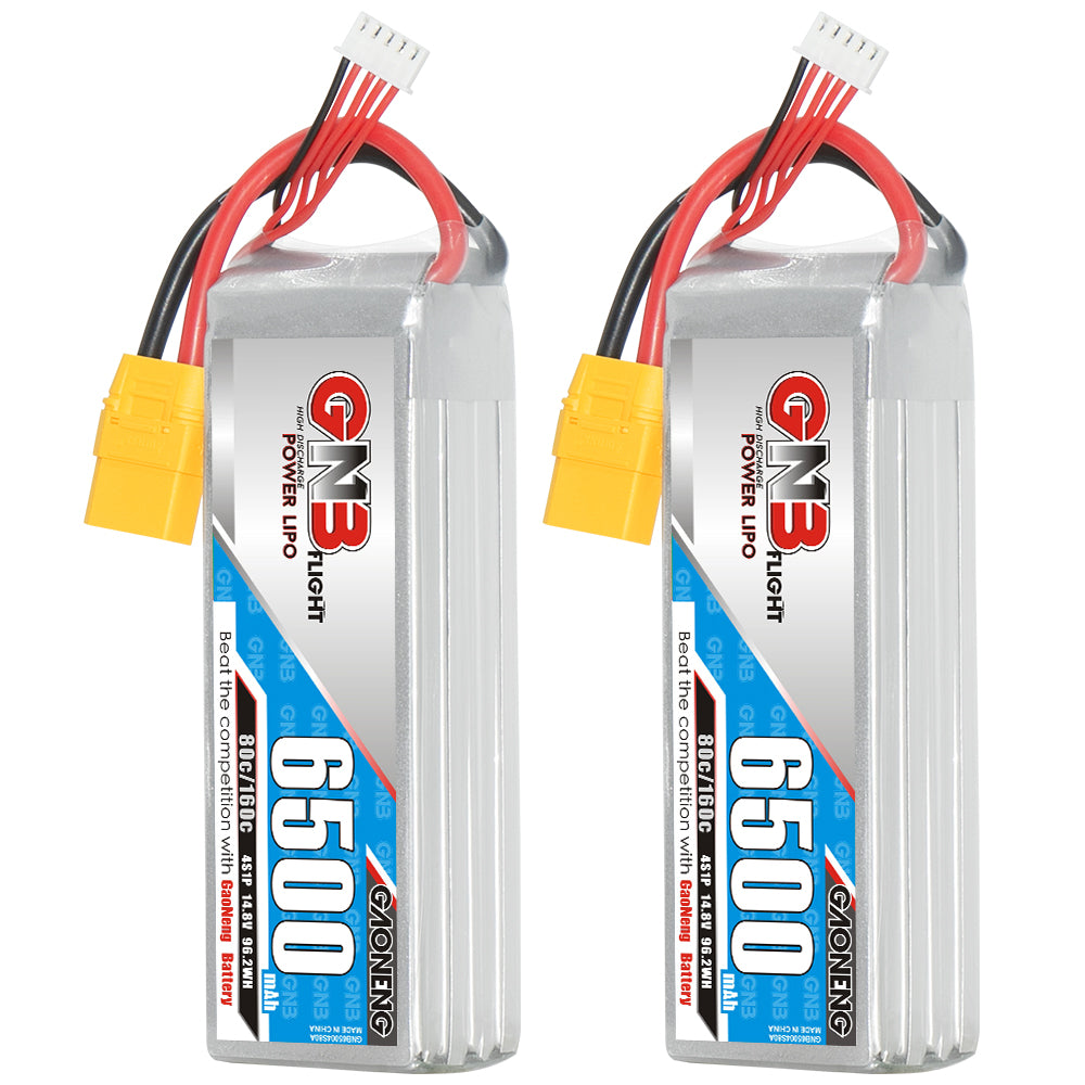 Two GAONENG GNB 6500mAh 4S LiPo batteries standing upright with yellow XT90 connectors