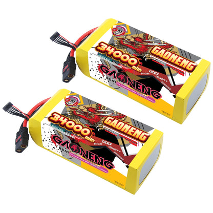 Two GAONENG 34000mAh 6S battery packs shown together with QS8-style discharge leads and balance plug
