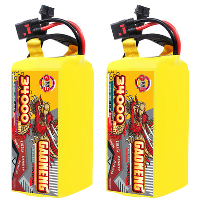 Two GAONENG 34000mAh 12S battery packs standing upright with attached power and balance leads
