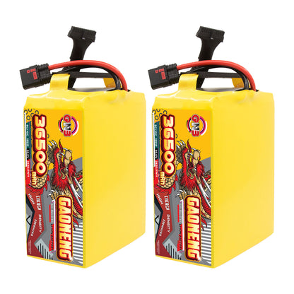 Two yellow GAONENG 36500mAh battery packs shown upright, side label view with top leads