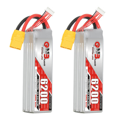Two GNB 6200mAh LiPo packs standing upright showing label side and wiring leads