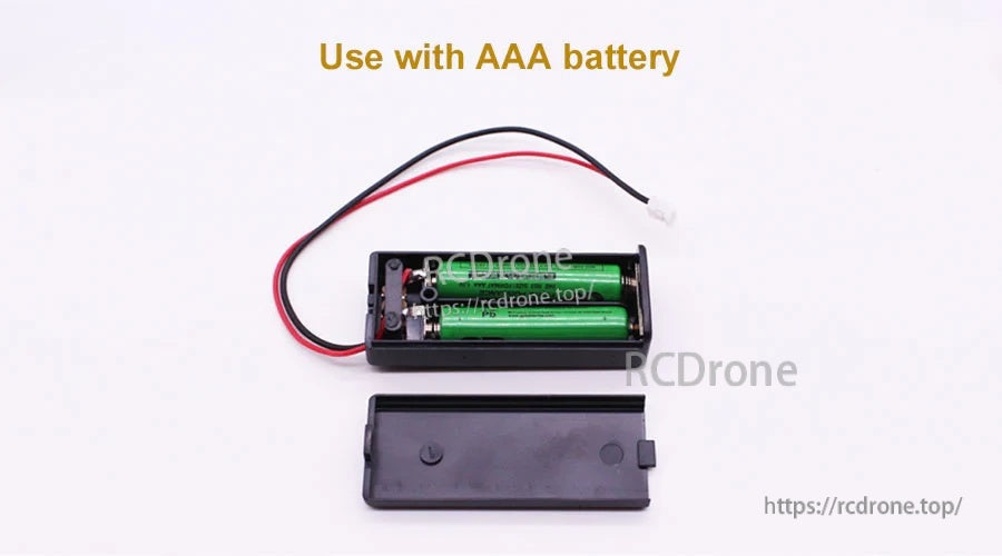 Open battery holder with two AAA cells installed and removable cover beside the case