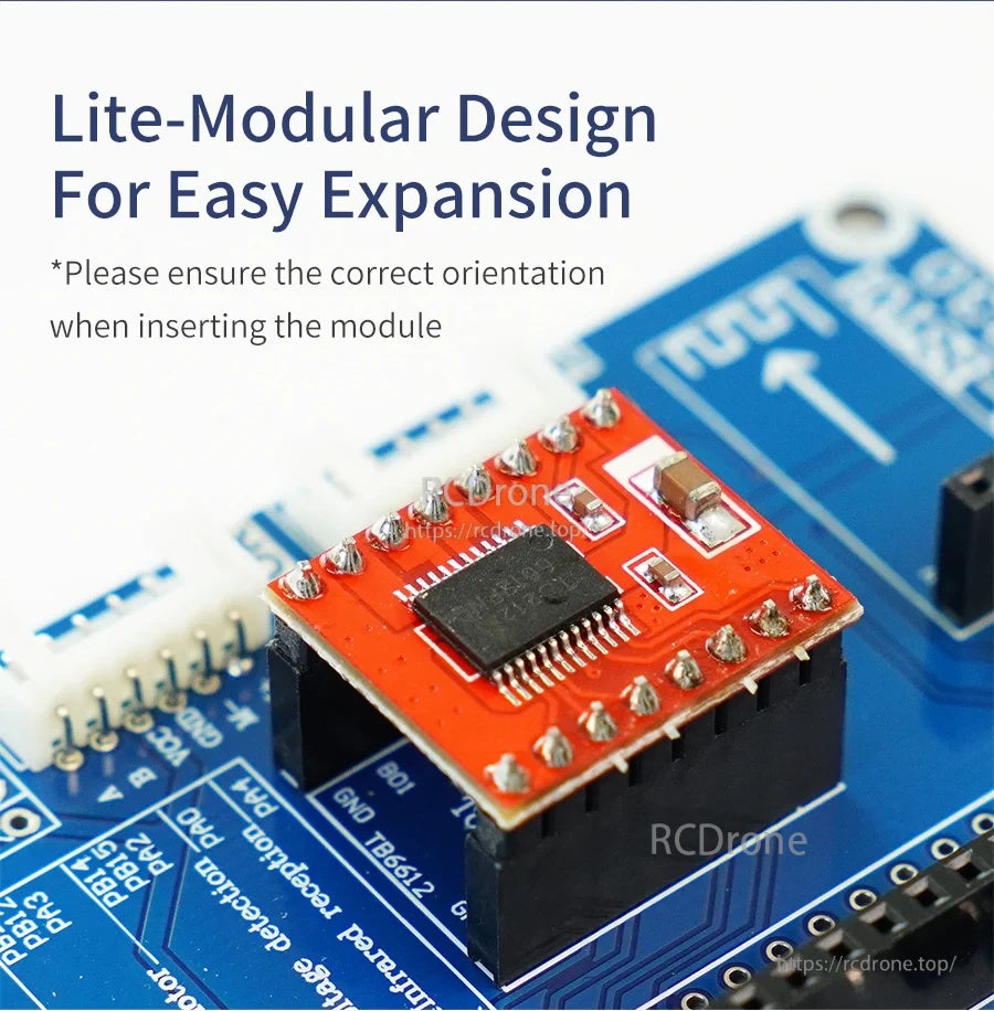 Plug-in 2-channel motor driver module on blue expansion board with pin headers and orientation marking