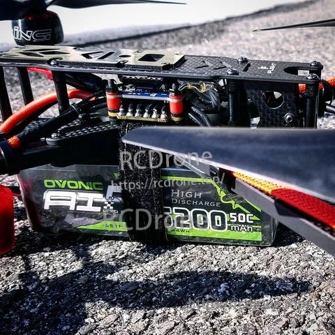 Ovonic 2-Pack 6S 5200mAh 50C 22.2V LiPo battery installed in an RC car chassis, soft-case pack