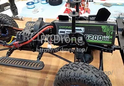 Ovonic Force 2S 6200mAh hardcase LiPo battery installed in an RC truck battery tray with Deans plug