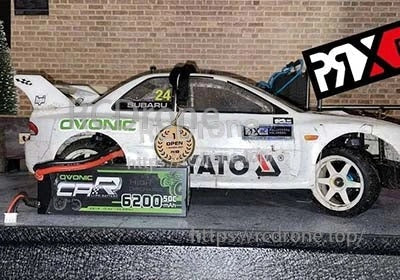 Ovonic Force 6200mAh 50C 2S hardcase LiPo pack beside a 1/10 scale RC rally car for size reference