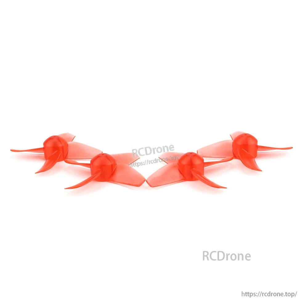 Side profile lineup of four translucent red 4-blade props showing blade curvature and clearance