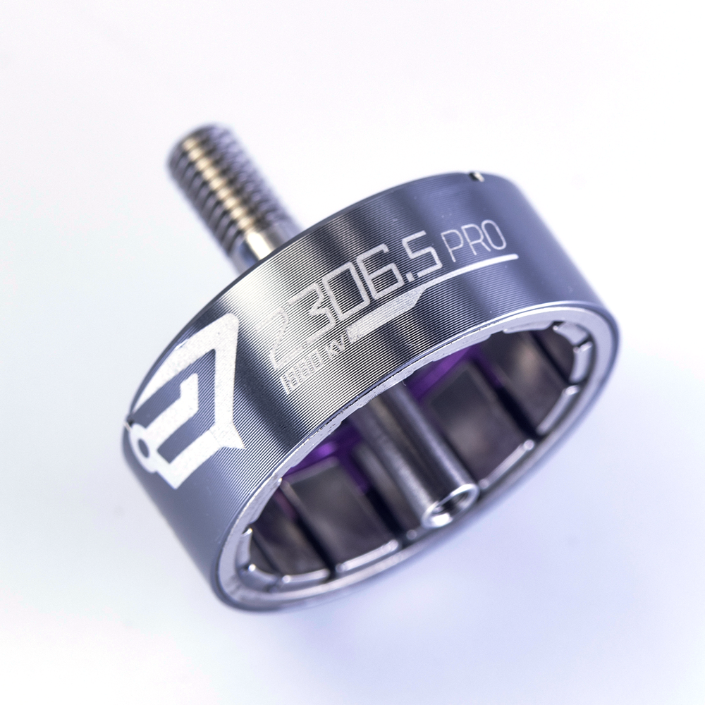 Close-up of SpeedyBee BeeStorm 2306.5 PRO FPV drone motor bell with 1880KV marking and threaded shaft.
