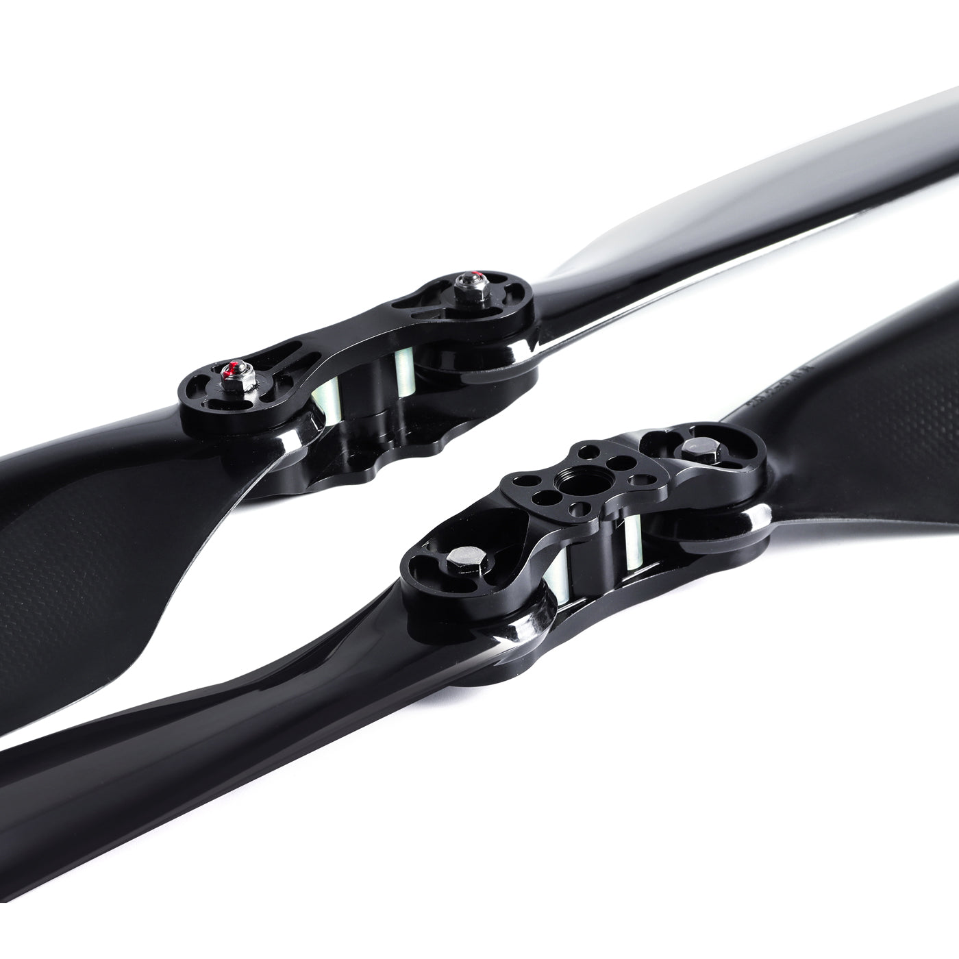 Glossy carbon fiber folding propeller with two blades and black center hub with mounting holes and hinge pins