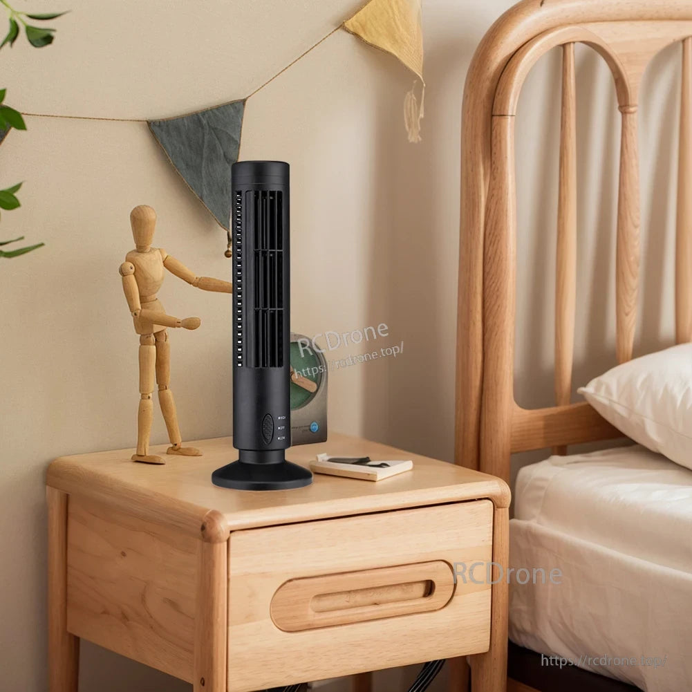 Black bladeless LED tower fan on a bedside table, compact vertical design for nightstand cooling