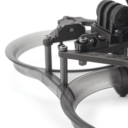 Close-up of standoffs and fasteners connecting top plate to ducted base