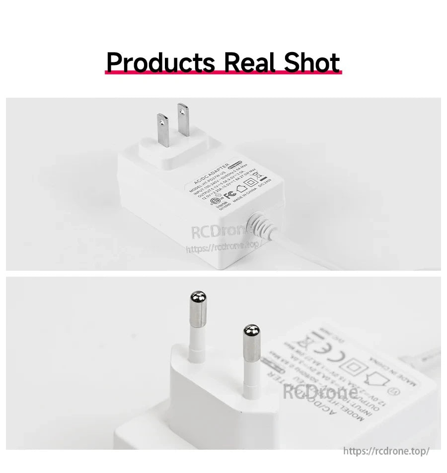 Real-life close-up of the white wall charger body and AC plug prongs