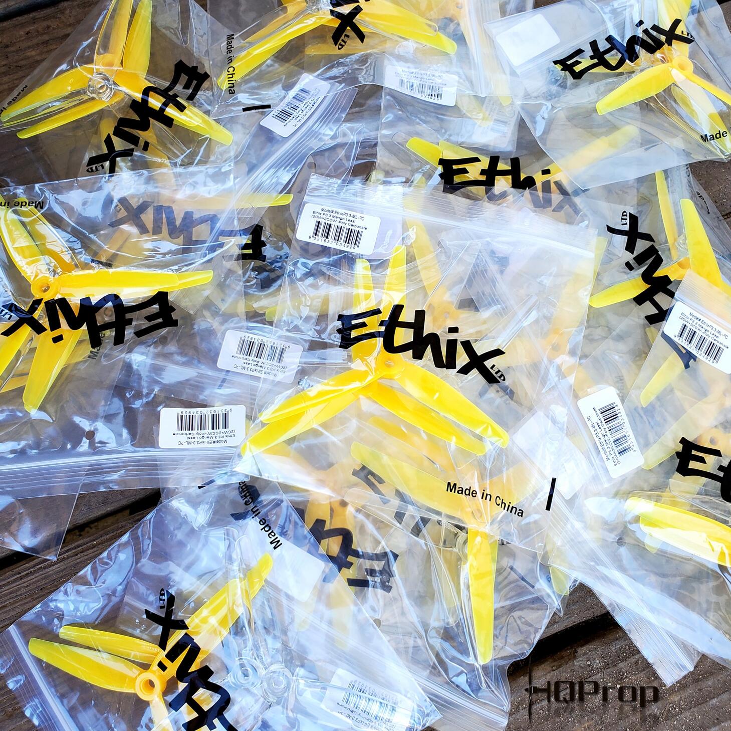 Ethix-branded zip bags with yellow 3-blade propellers and barcode labels spread on a table