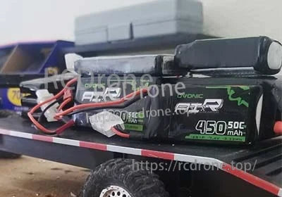 OVONIC 2S 7.4V 450mAh 50C LiPo battery packs with JST-SYP-2P leads in a compact RC setup