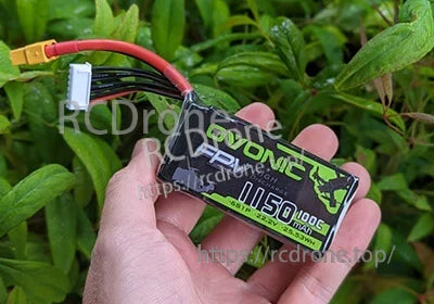 Handheld Ovonic FPV 6S 1150mAh 100C LiPo battery with label and leads visible