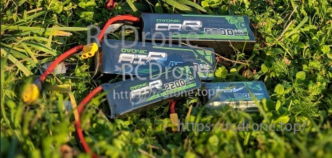 2× Ovonic 3S 2200mAh 25C 11.1V LiPo batteries with XT60 leads on grass