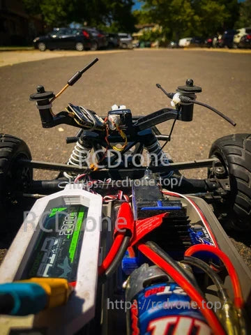 Ovonic 3S 2200mAh LiPo battery installed in an RC car battery tray with wired Deans connector