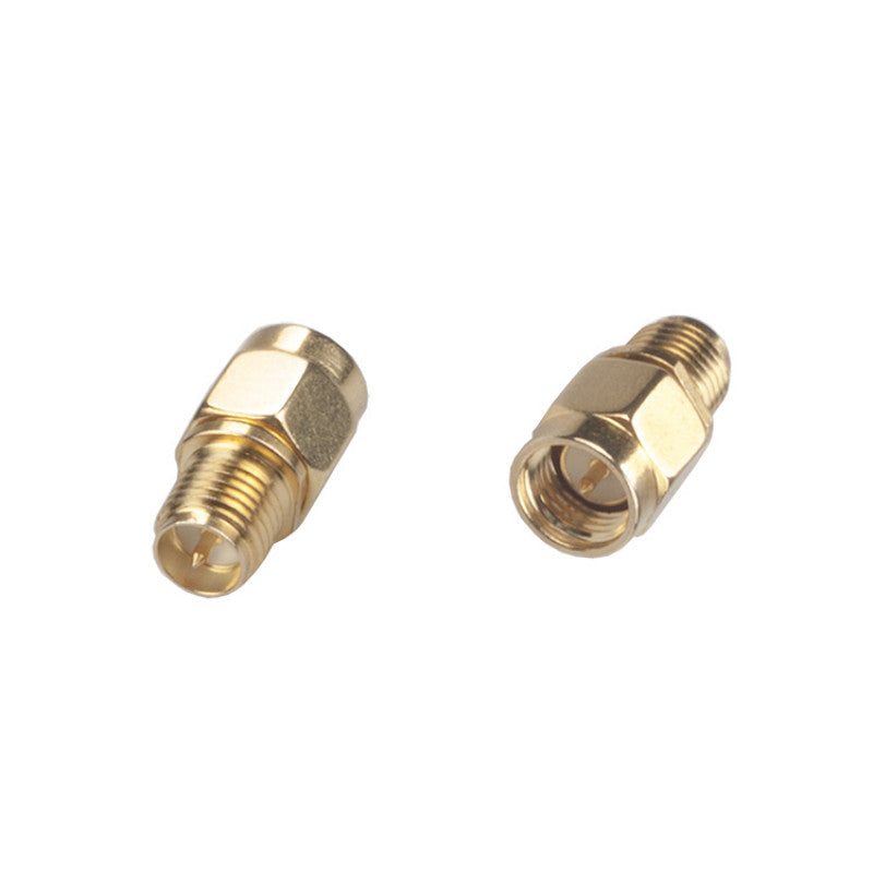 Pair of gold RF coaxial adapters with SMA male plug to RP-SMA female connector ends