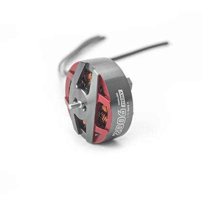 Angled side view of Spinnybois 2006 brushless motor with shaft, red frame, and wire lead