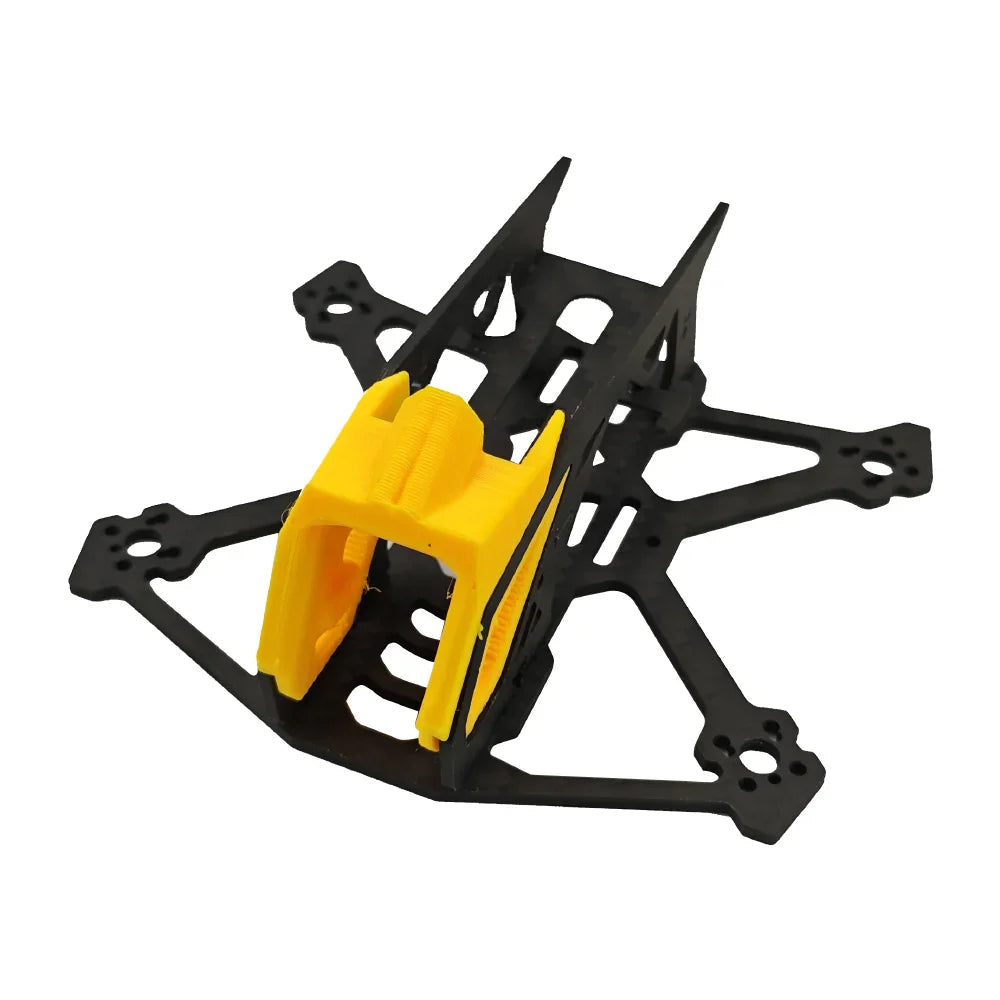 Angled view of BabyApe III Mini Wide-X FPV frame showing carbon arms and yellow camera canopy