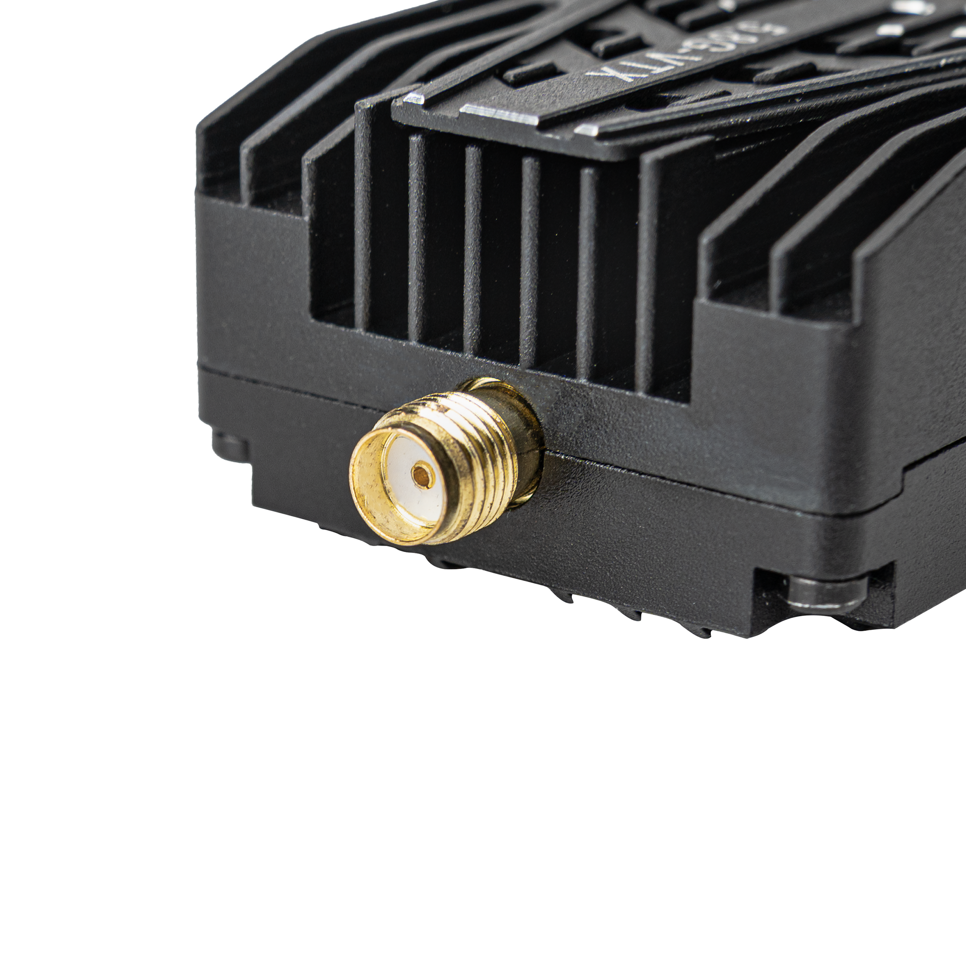 Close-up of VTX gold SMA antenna connector on finned heatsink housing