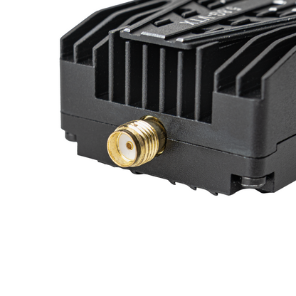 Close-up of VTX gold SMA antenna connector on finned heatsink housing