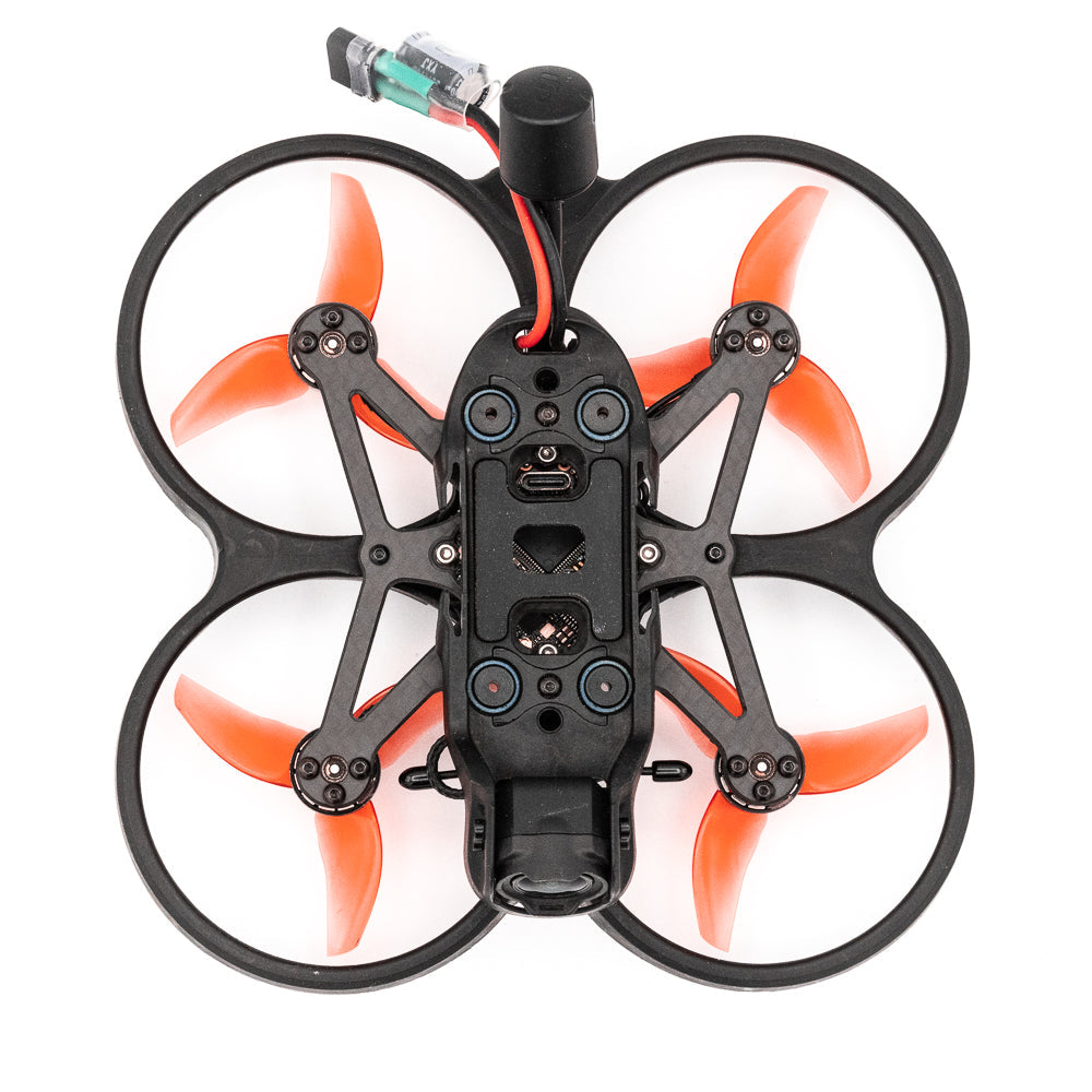 Top-down view of Cinehawk Mini ducted quad showing frame layout, four ducts, and orange propellers