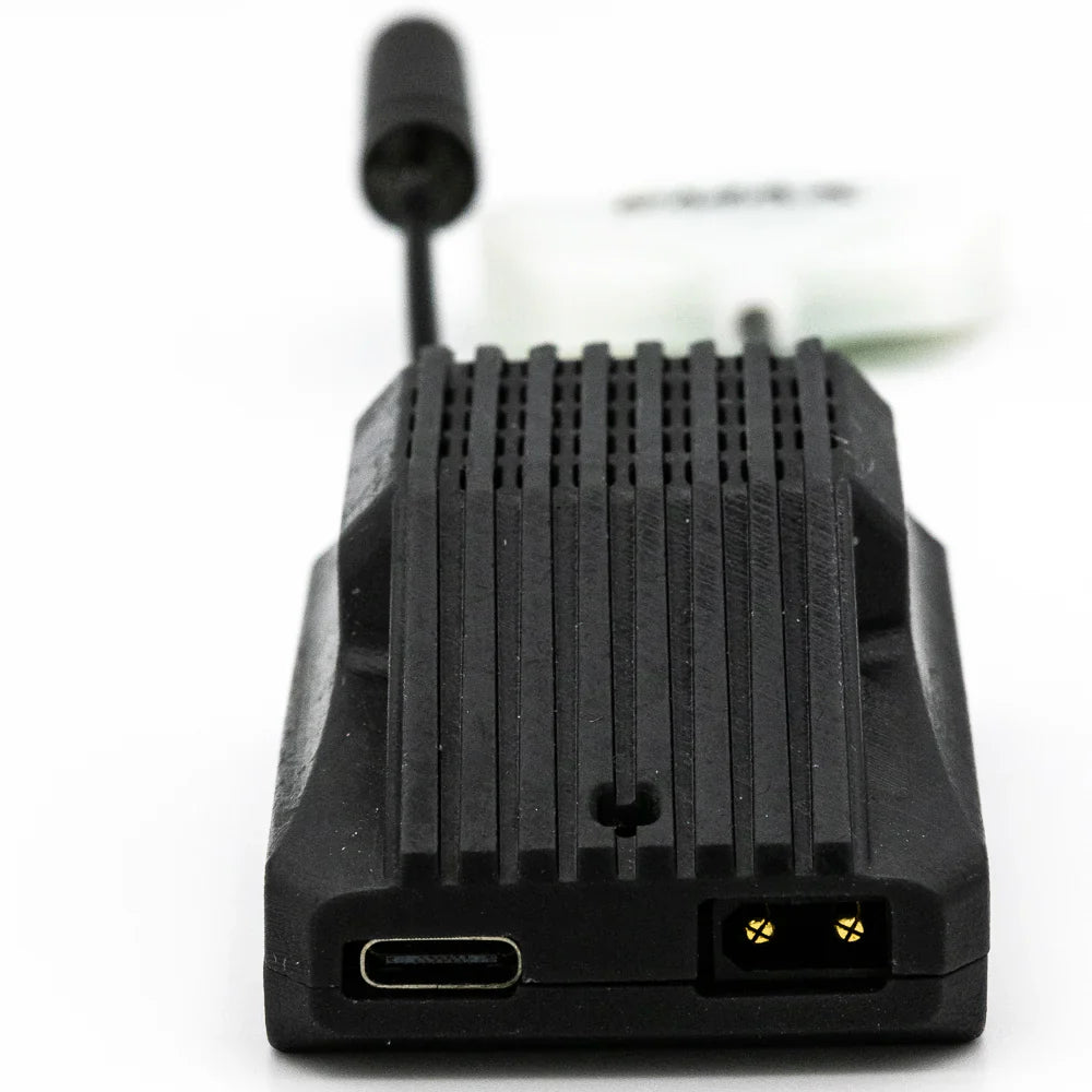 Close-up of Wyvern Link VRX front edge showing USB-C port and power connector