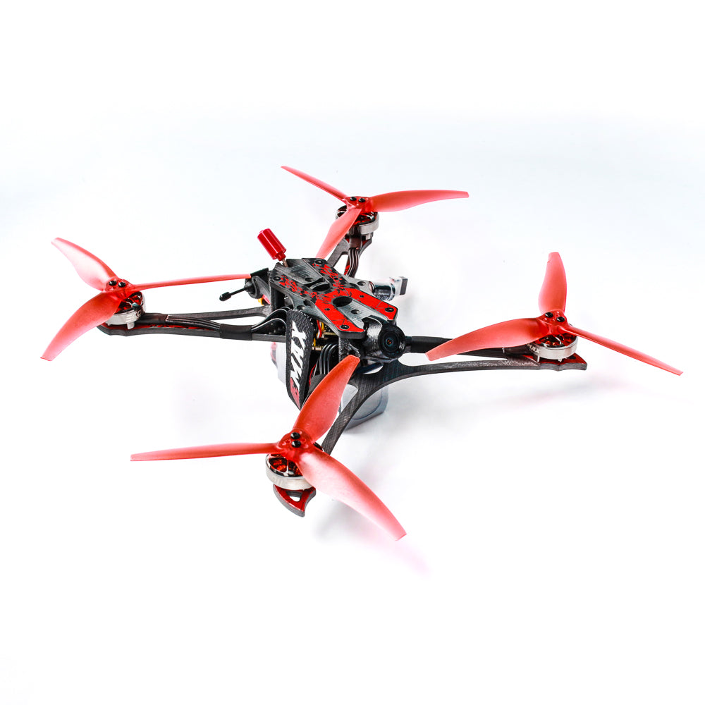 Angled side view of EMAX Hawk Apex quadcopter showing carbon fiber arms, red props, and top plate