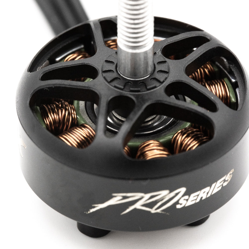Close-up of PRO Series motor top bell showing vented spokes and copper windings around the stator