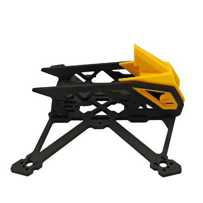 Side view of BabyApe III 3-inch Wide-X frame showing carbon fiber plates and yellow TPU canopy
